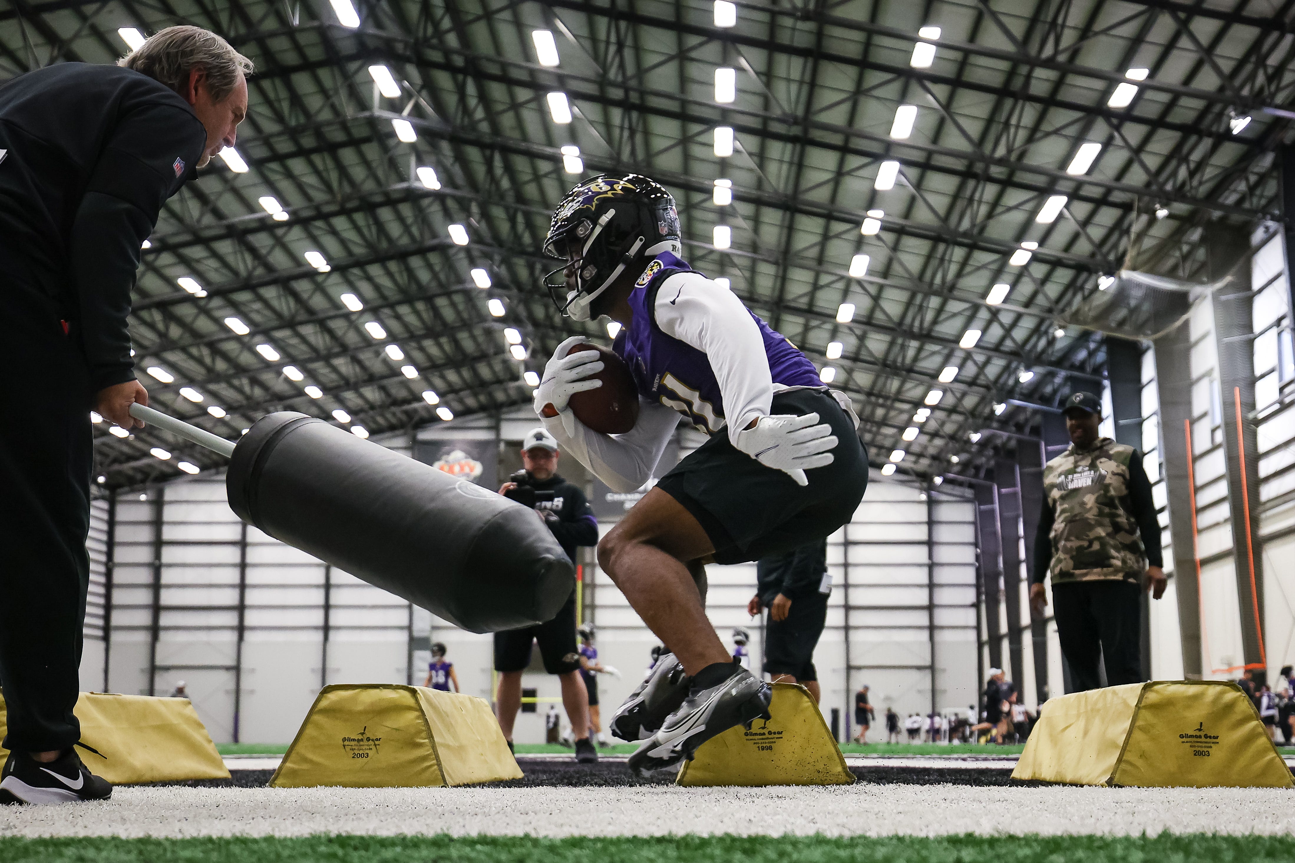 Baltimore Ravens running back Ricky Person participates in a drill during rookie minicamp at Under Armour Performance Center on May 7.