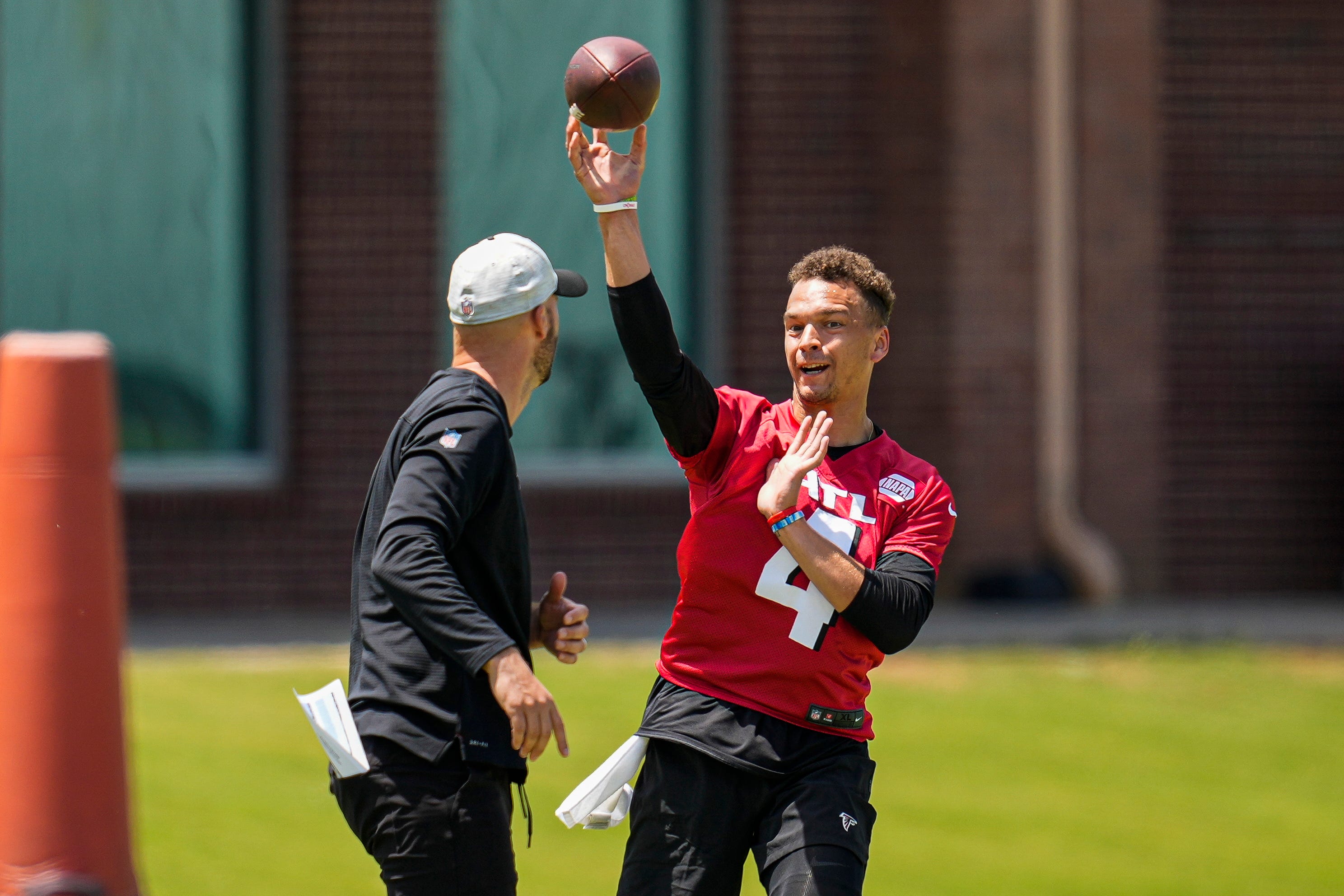 Atlanta Falcons quarterback Desmond Ridder passes during rookie minicamp at the Falcons Training Complex on May 14.