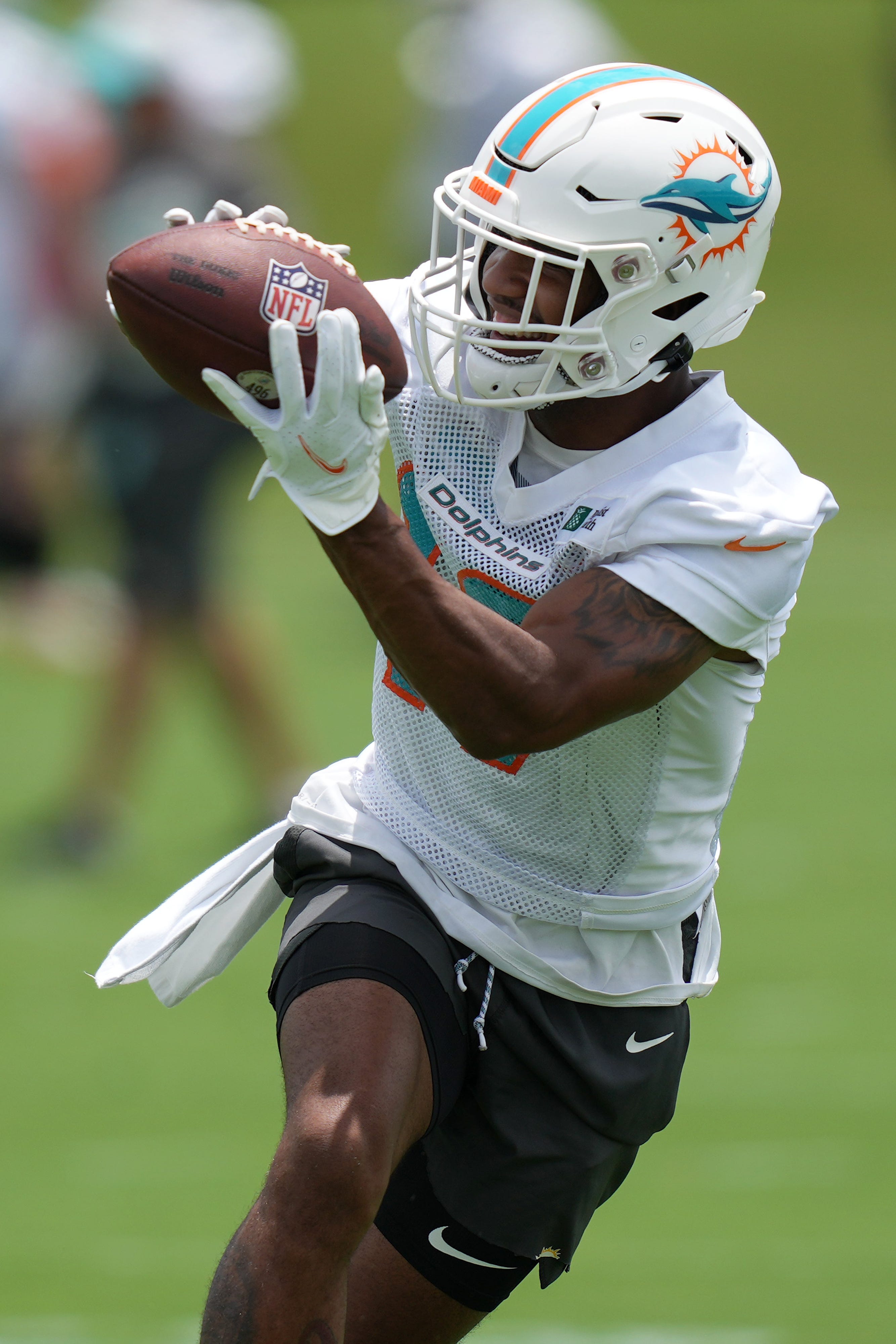 Miami Dolphins wide receiver Jaylen Waddle catches a pass during OTA practice on May 24.