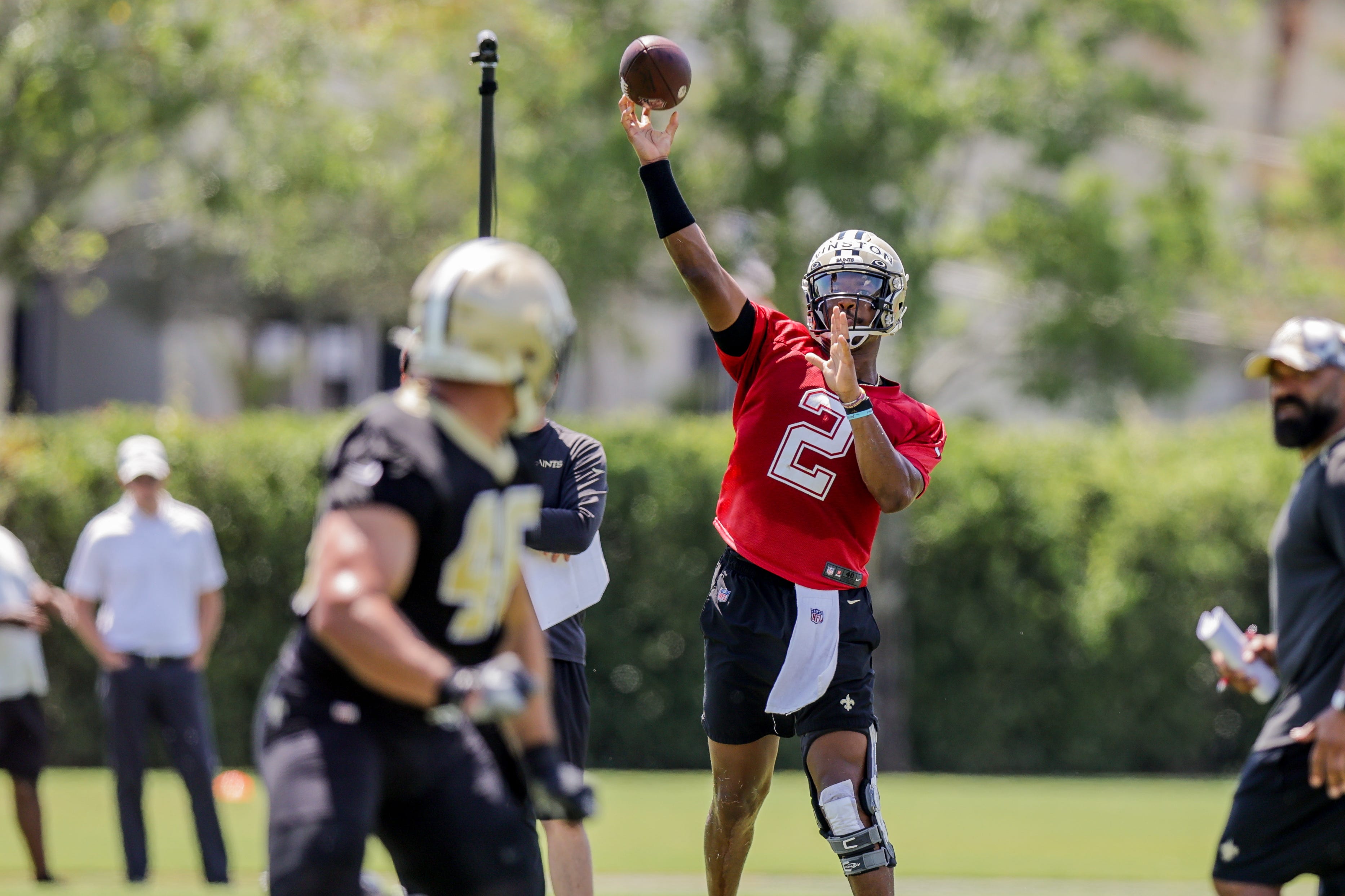 New Orleans Saints Jameis Winston (2) works on passing drills with Adam Prentice during organized team activities on June 2.